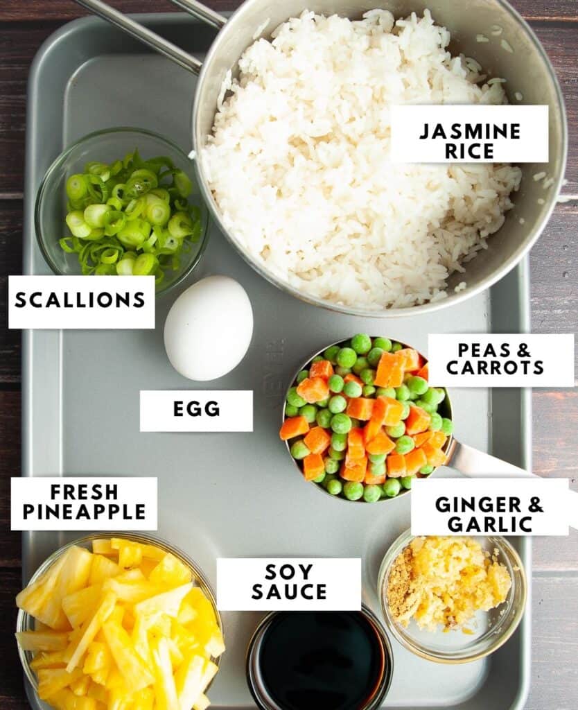 Ingredients for fried rice on a baking sheet with labels