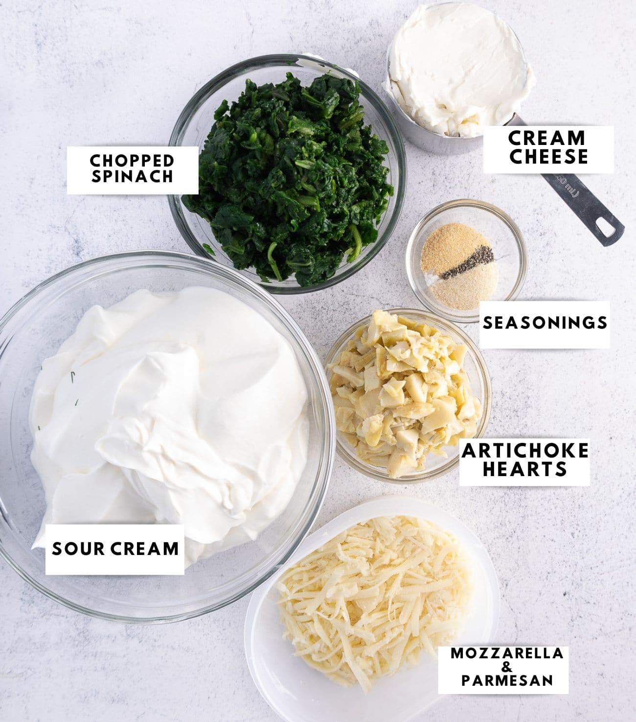 Ingredients to prepare mayo free spinach artichoke dip labelled