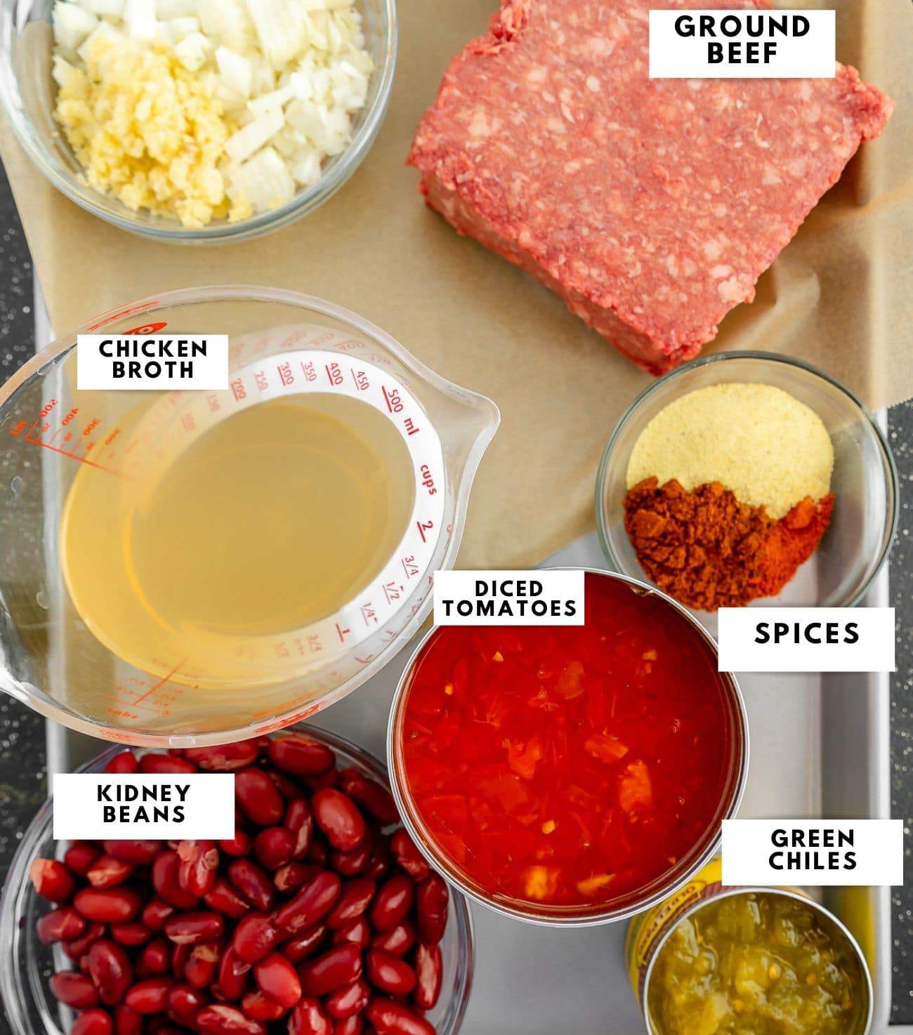 Ingredients for texas roadhouse chili labelled on a sheet pan. 