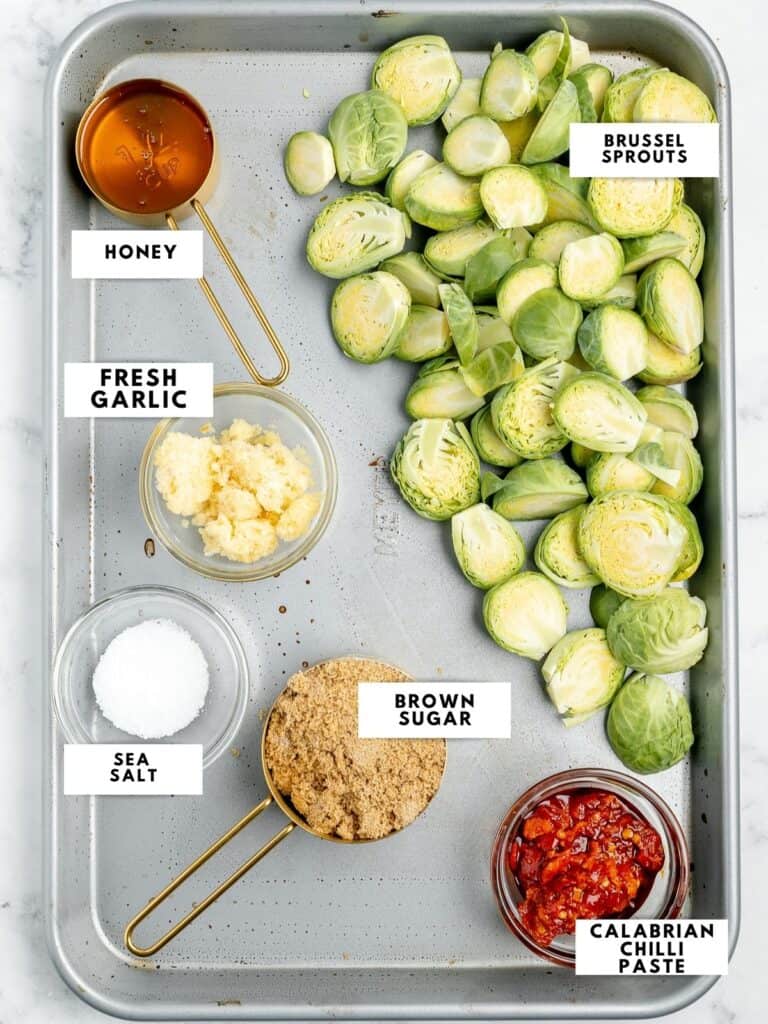 Ingredients for longhorn brussel sprouts labelled on a sheet tray.