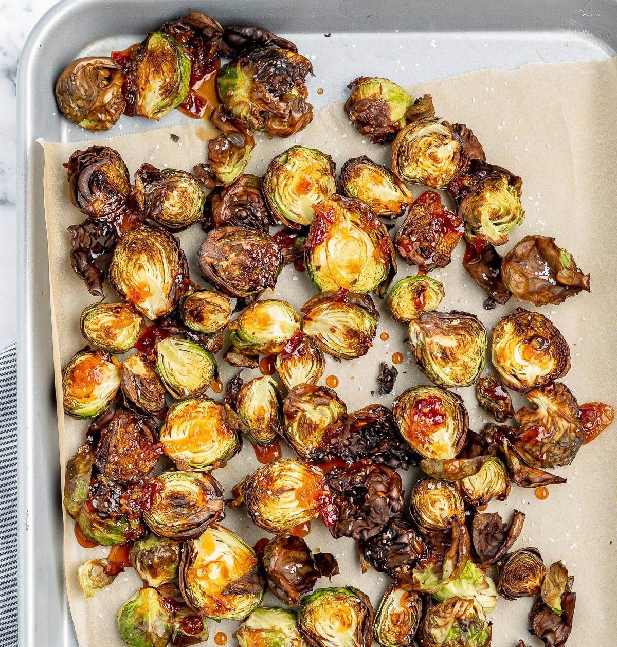 Longhorn brussel sprouts on a sheet tray.