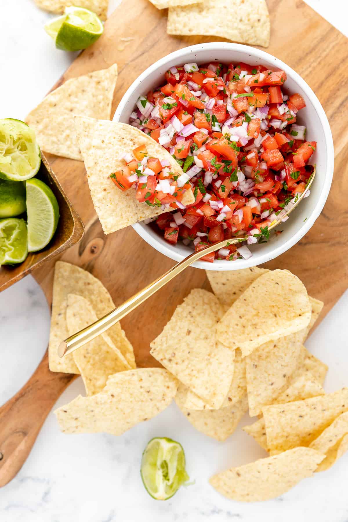 Fresh tomato salsa in a bowl, served with tortilla chips.
