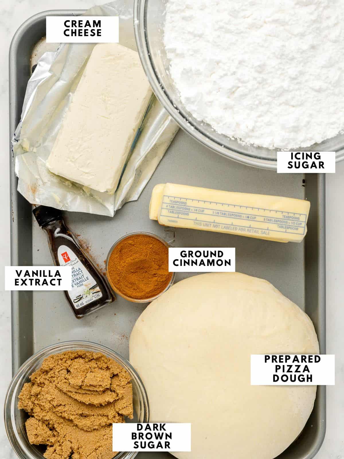 Ingredients to prepare the recipe, labelled on a sheet tray.