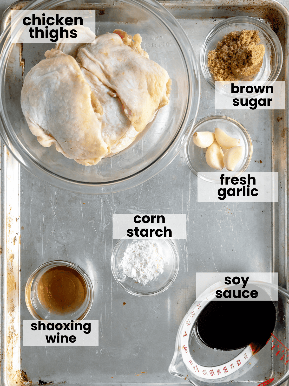 Recipe ingredients labelled on a sheet tray.