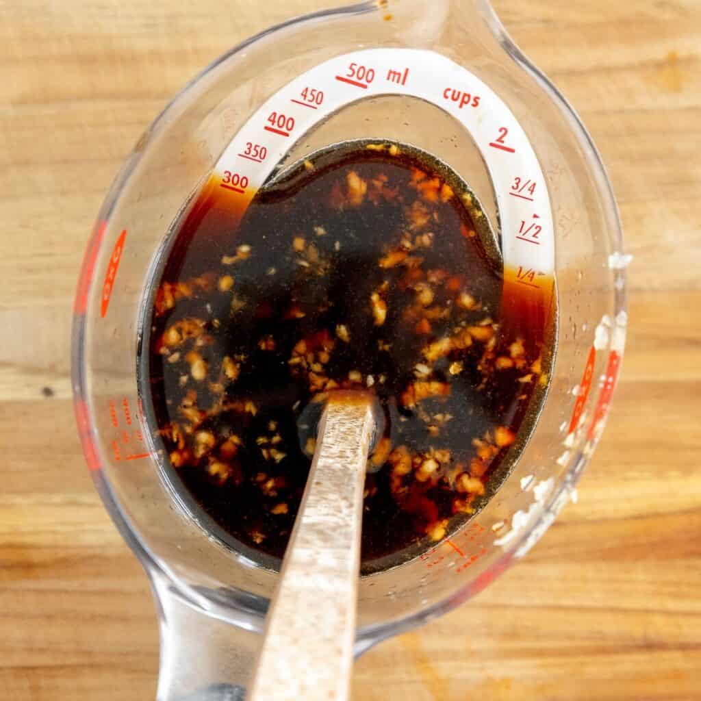 Teriyaki sauce mixed in a measuring cup. 