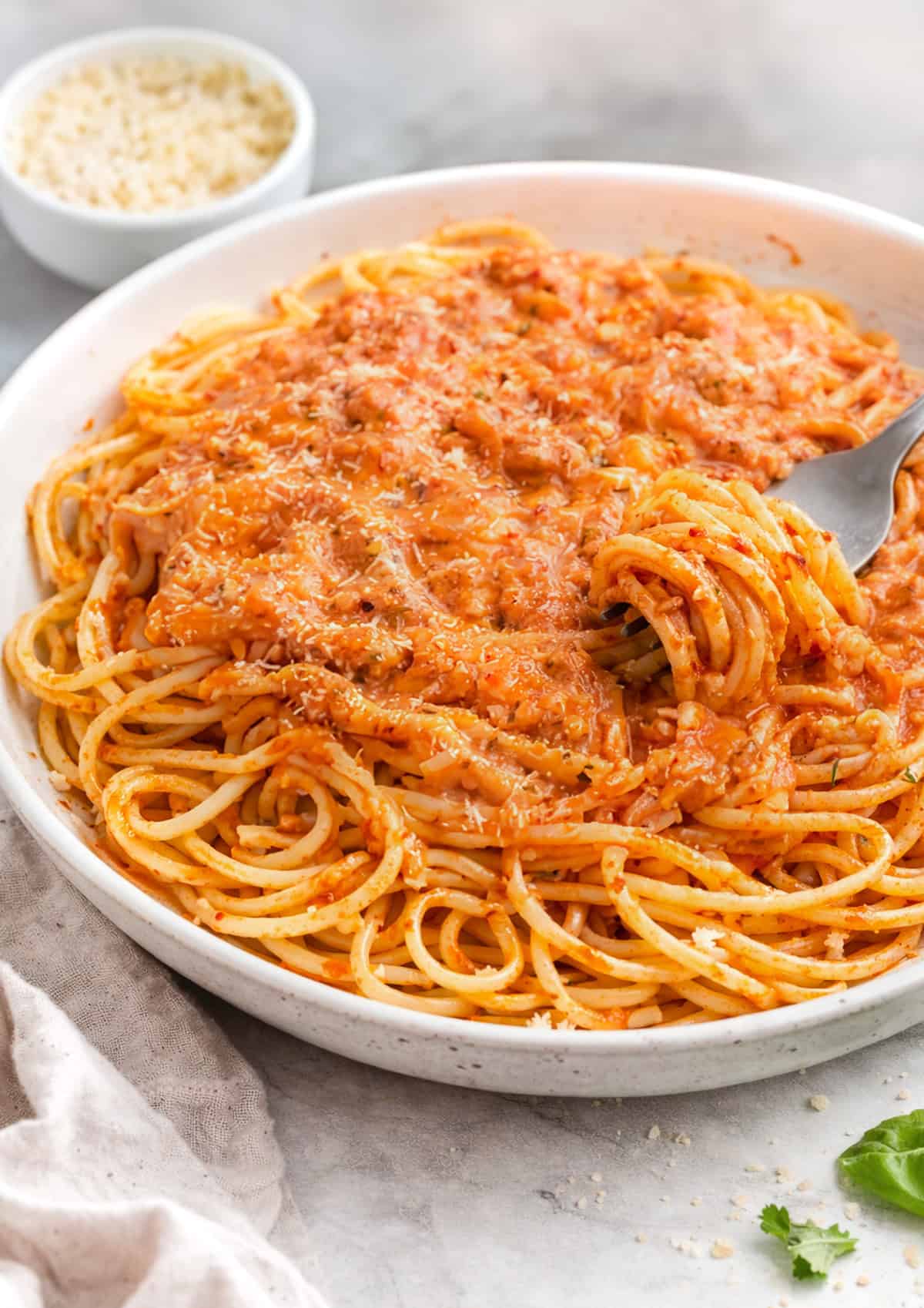 Olive Garden five cheese marinara sauce served on cooked spaghetti in a bowl.