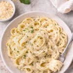 Olive Garden Alfredo Pasta in a bowl, with a fork twirling pasta.